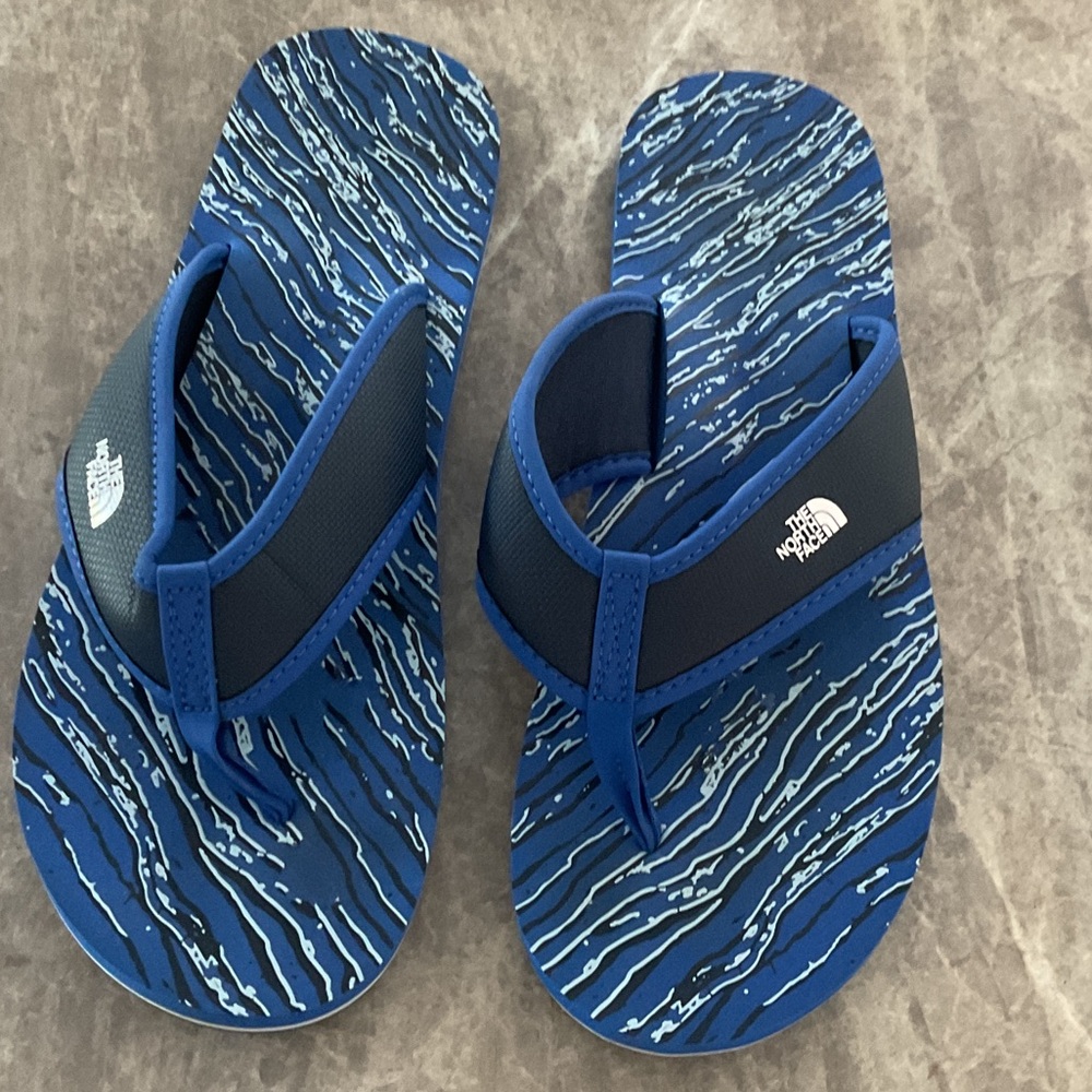The North Face Blue and Gray Flip Flops